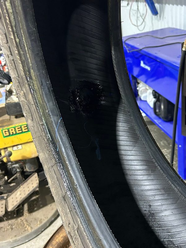 Inside of the tyre showing the internal patch repair over the puncture
